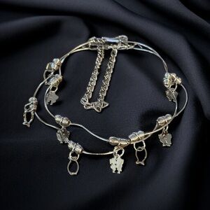 Silver tone wavy bangle charm bracelets